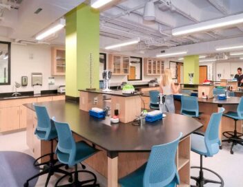 Students stand at newly constructed lab stations